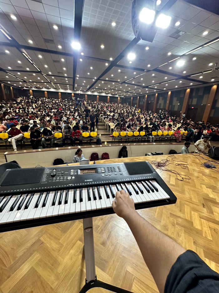 View from the keyboard to a packed auditorium